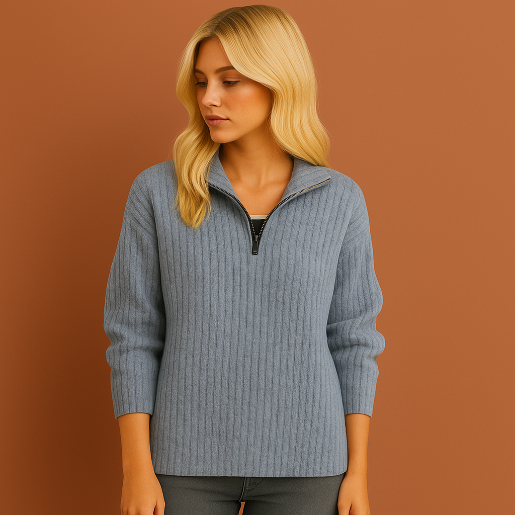 Blauwe damestrui met half-zip en hoge kraag, stijlvolle pasvorm perfect voor casual en elegante outfits.