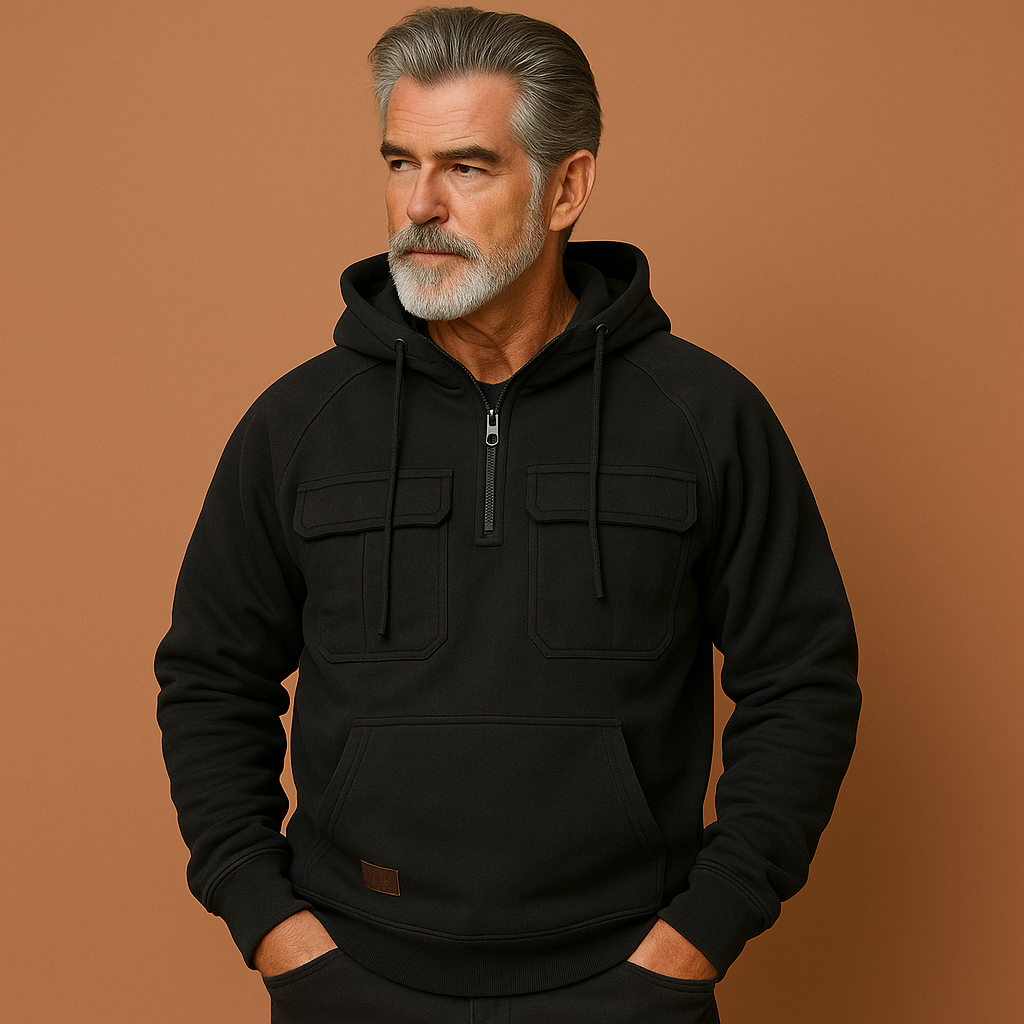 Grijze hoodie voor heren met zachte pasvorm en praktische zakken, ideaal voor koude dagen en casual outfits.
