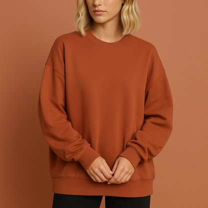 Lange oversized damestrui in oranje met comfortabele pasvorm, zacht en stijlvol voor herfst en winter.