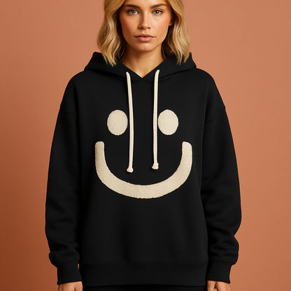 Warme hoodie met smiley voor dames in zwart met relaxed design en comfortabele pasvorm voor casual outfits.